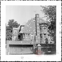 [Side view of home on northwest corner of 85th Street and 11th Avenue (85th Street side showing).]