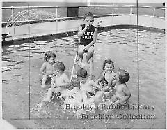 [Six orphan children in wading pool]