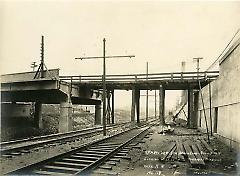 Looking west showing temporary bridge over R.R.
