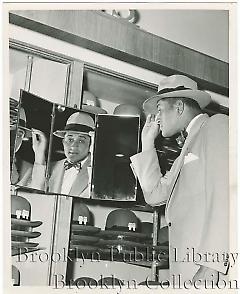 [Don Newcombe in clothing store]