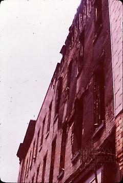 [Side view of townhouse facade]