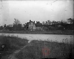 [Farmhouse, outbuildings, and road]