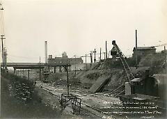 Looking west from bridge over L.I.R.R. showing contractors equipment between 7th and 8th Aves.