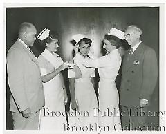 A nurse gets her cap