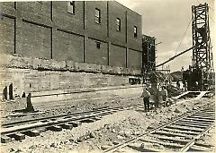 Showing concreting of foundation and incline walls at east end of Desbrocks looking east