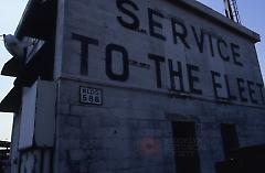 [Old sign on the wall, "service to the fleet"]