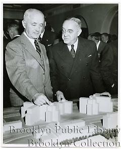 [Men examining architectural model of proposed changes to Brooklyn Civic Center]
