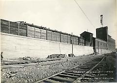 Looking east from 16th Ave. showing finished concrete walls north side right of way