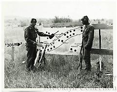 [Two soldiers with diagram]
