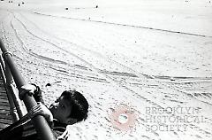 [Boy on Coney Island boardwalk]