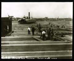 Views: Brooklyn, Long Island, Staten Island. Brooklyn scenes; buildings. View 028: Ferry boat leaving Brooklyn for Wall Street, Sept 27 1894. New East River Bridge at work on caisson.