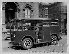 [Two men standing in Abraham & Straus delivery van]