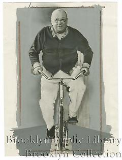 [Wilbert Robinson on stationary bicycle]