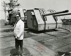 [Man in white suit jacket and sunglasses at Brooklyn Navy Yard]