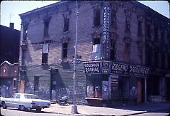 [Abandoned town house and storefront]