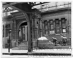 [Workers clearing debris in front of court house building in Brooklyn Heights]