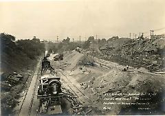 Looking west from 5th Ave. showing equipment of Wilson and English Co.
