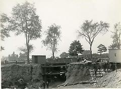 [Subway construction with scaffolding under bridge]