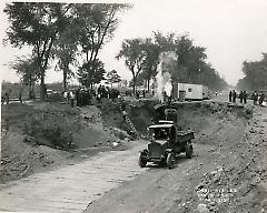 [Subway construction on Eastern Parkway with steam shovel in trench]