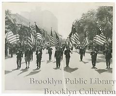 [Veterans marching on Eastern Parkway]