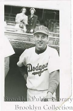 [Carl Erskine posing in dugout]