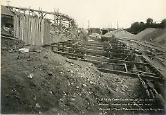 Showing trenching and concreting in cut between 4th and 5th Aves. looking east from trolley tracks