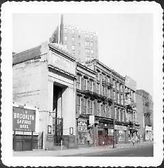 [The Brooklyn Savings Bank (#300 Fulton Street) (left.) George Levin - Used and New Office Furniture (#298 Fulton Street) (center), also called H & H Desk Co.]