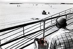 [Man on the Coney Island boardwalk]