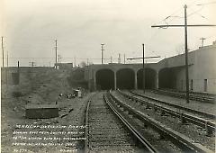 Looking east from 200 feet west of 14th Ave. showing road bed, portals and former incline for trolley cars