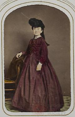 [Woman Wearing Fashionable Hat and Dress]