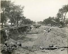 [Subway construction on Eastern Parkway with workers laying track]