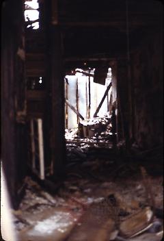 [Interior of a destroyed building]