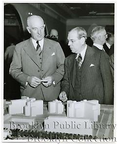 [Men examining architectural model of proposed changes to Brooklyn Civic Center]
