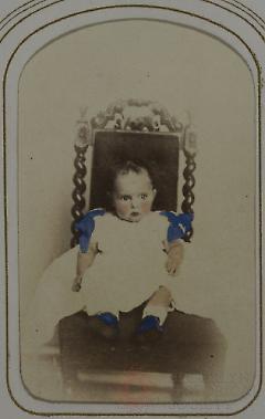 [Infant Seated in Ornate Chair]