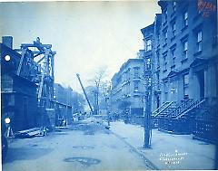 [Street in Brooklyn Heights with derrick, boom, and sheds]