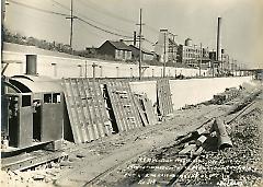 Showing finished concrete retaining walls on south side looking east from L.I.R.R.