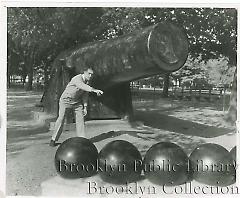 [Carl Erskine in front of cannon]