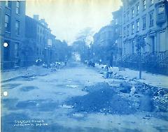View of Joralemon street west of Henry street, showing stone cutters at work on curb stones