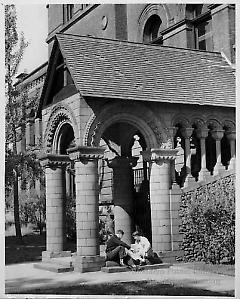 [Two male students at entrance of Pratt Institute Library]