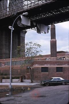 [Building and car under Brooklyn Bridge]