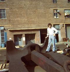 [Arthur Rosenberg standing on an anchor at the Navy yard]