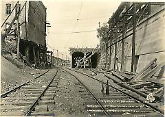 Cut looking west from 200 feet east of 18th Ave. showing arches for 8th Ave. highway bridge and underpinnings of houses
