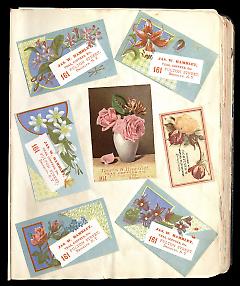 Full view of scrapbook page. Includes 6 tradecards for Brooklyn business: James W. Hamblet.