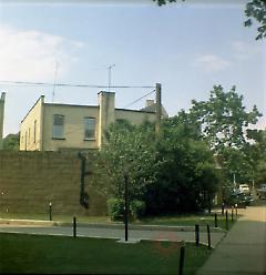 [Yellow house at corner of Fraser Square.]