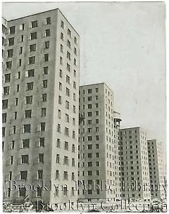 [Four apartment towers under construction]