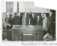 [Group portrait in Central Courts Building at 120 Schermerhorn Street]