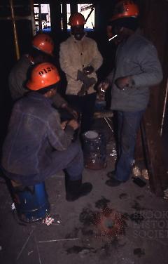 [Ship fitters trying to warm up on the Ro-Ro container ship]