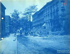[Joralemon Street with workers and wooden barrier]