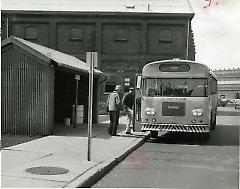 [Workers getting on a bus]