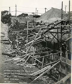 Showing trench and concrete work on cut at 4th Ave. looking north from spoil heap